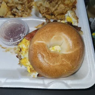 Bacon, egg, and cheese bagel with house fries.