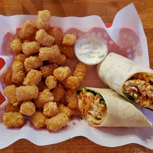 Chicken wrap and tots with a side of their house made ranch