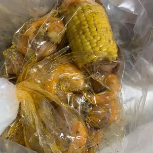 Shrimp(no head)&amp;sausage, corn, and one small potato. Was good.