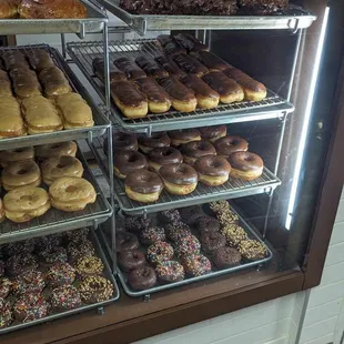 a display case full of doughnuts