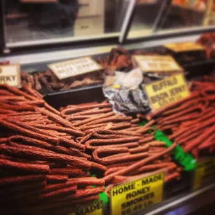 Find the jerky and smokies in a separate refrigerated display case