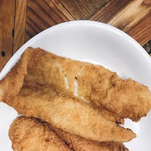 a plate of fried fish