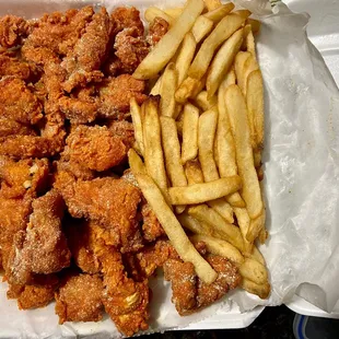 1 lb. Catfish Nuggets ( hidden under the paper is a Cole slaw and 2 slices of white bread)