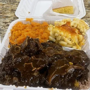 Oxtails, Mac, Cheese Candied Yams and Corn Bread
