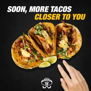 a hand reaching for a taco