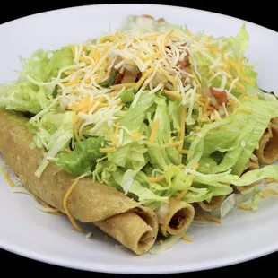 Ground beef Rolled tacos 
 Guacamole , lettuce, cheese and pico de gallo