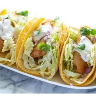 a plate of fish tacos