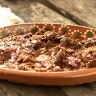 a bowl of shredded beef