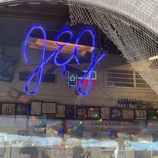 Window view looking inside from the covered, front porch dining.