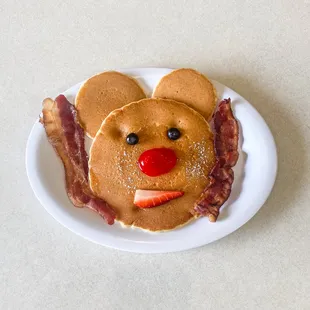 a plate with pancakes and bacon