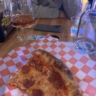 Pepperoni slice (half eaten sorry) and a Virginia rosé
