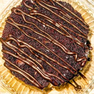a chocolate cake with chocolate drizzle