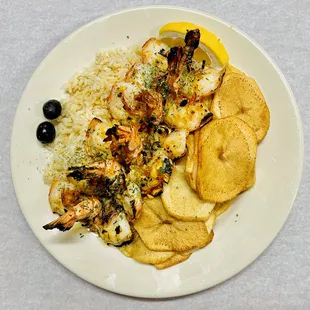 Camarão grelhado (Six grilled jumbo shrimp, rice, homemade fries and garlic sauce)