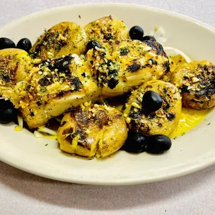 Bacalhau lagareiro (Grilled codfish, baked baby red potatoes and garlic olive oil)