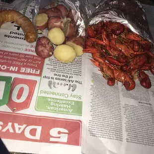 Crawfish boudin, boiled potatoes, boiled crawfish