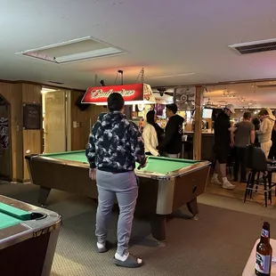 a pool table and a bar