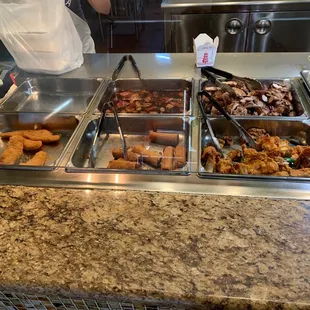 a buffet with a variety of food items