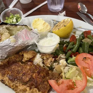 Crusted Cod fillet, baked potato and veggies