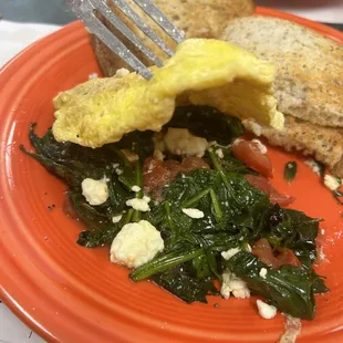 Greek omelette filled with fresh spinach, feta and tomatoes.