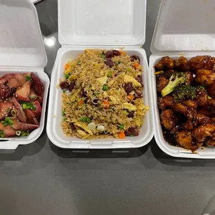 three takeout containers of food