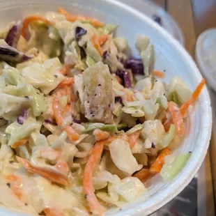 Pineapple piece on top of coleslaw