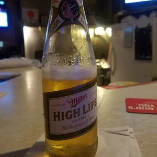 ows a bottle of high life