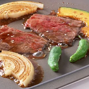 steak and vegetables on a pan