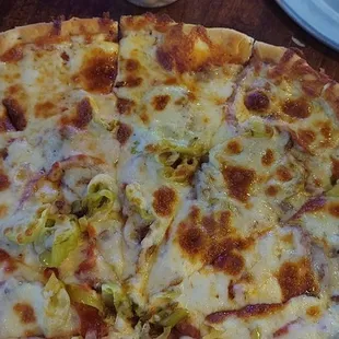 Large pizza with pepperoni, peppercinis, mushroom and onion