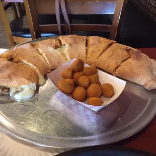 Lg steak stromboli and partial order of mushrooms. Forgot to take pictures before digging in!