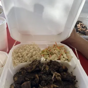 Jerk chicken, steamed rice, and cabbage