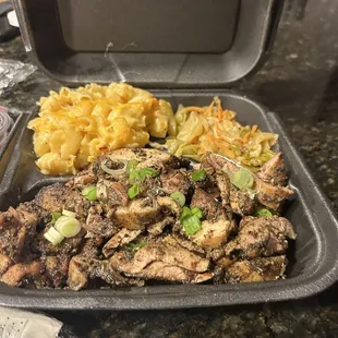 Mac n cheese and jerk chicken with cabbage