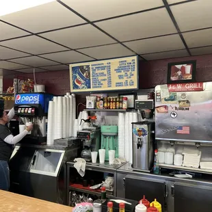 a man preparing food in a restaurant