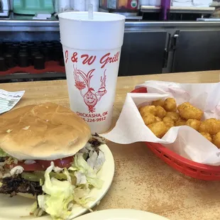 Onion cheeseburger fully dressed with tots and water. Simply delicious!