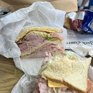 Ham and turkey double decker with American cheese, chips, potato salad and a soda.  All for less than $9.00.