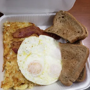 Hash browns, bacon, eggs, toast with butter. Standard, solid breakfast. Filling