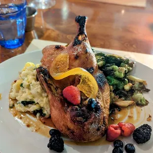 Crispy Roast Duck with risotto, berries and Brussels sprouts