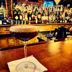 a glass of wine on a napkin