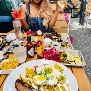 ows a woman enjoying a meal