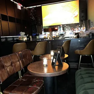  a table and chairs in a bar