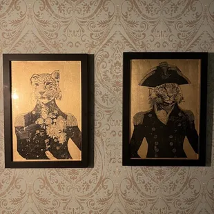  two framed portraits of a man and a woman