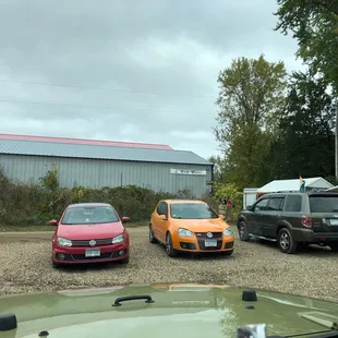 a group of cars parked in a parking lot