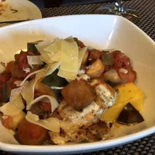 Ratatouille over grilled chicken on a bed of polenta.  So good .