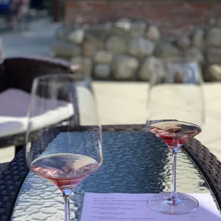 two wine glasses on a table