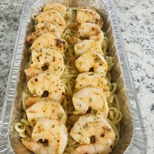 a tray of shrimp and noodles