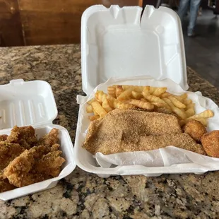 Fish and wings with tilapia and boneless honey garlic wings.  $12.99