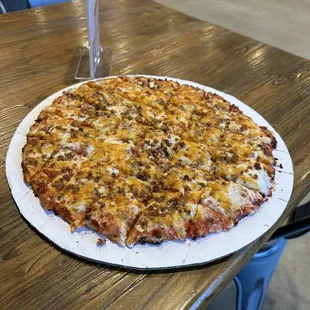 Taco pizza - 3 cheese blend, seasoned ground beef and Cholua sauce