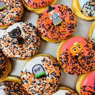 One dozen Halloween donuts