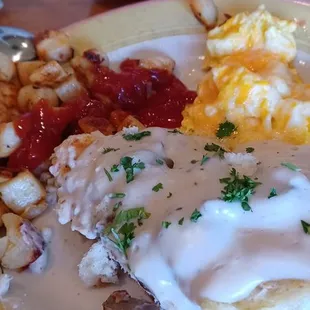 Just Bubba plate. Chicken sausage gravy over a open biscuit. Cheddar scramble eggs and potatoes.