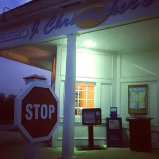 a stop sign in front of a restaurant