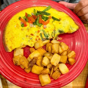 an omelet and potatoes